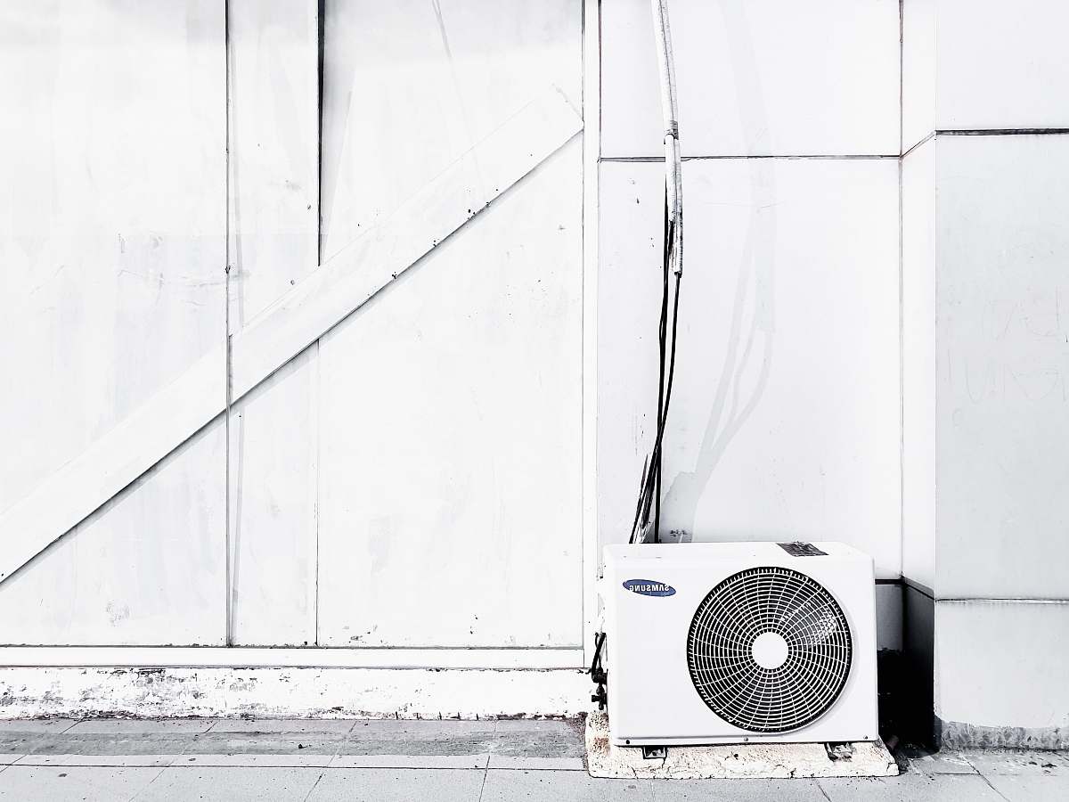 air conditioner grayscale photography of outdoor AC unit appliance